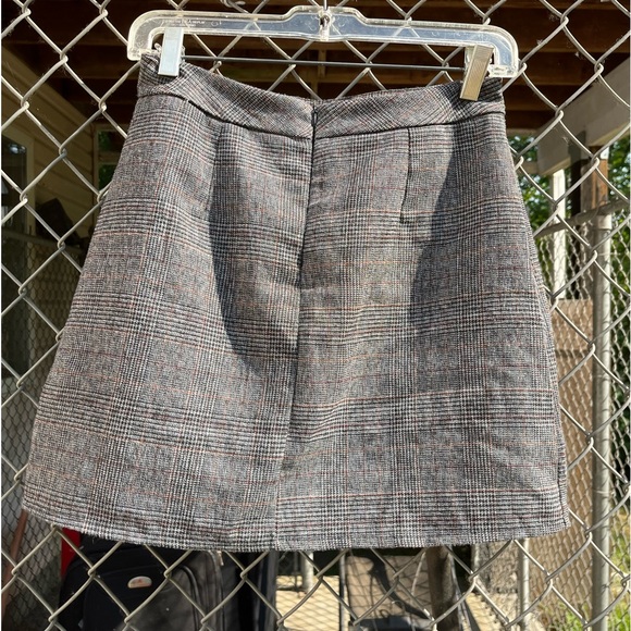 Pleated Mini Skirt With Sailor Style Buttons Down Front - Picture 2 of 6